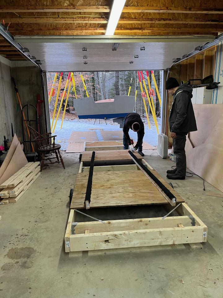 We put some plywood across the strongback for the keel to rest on